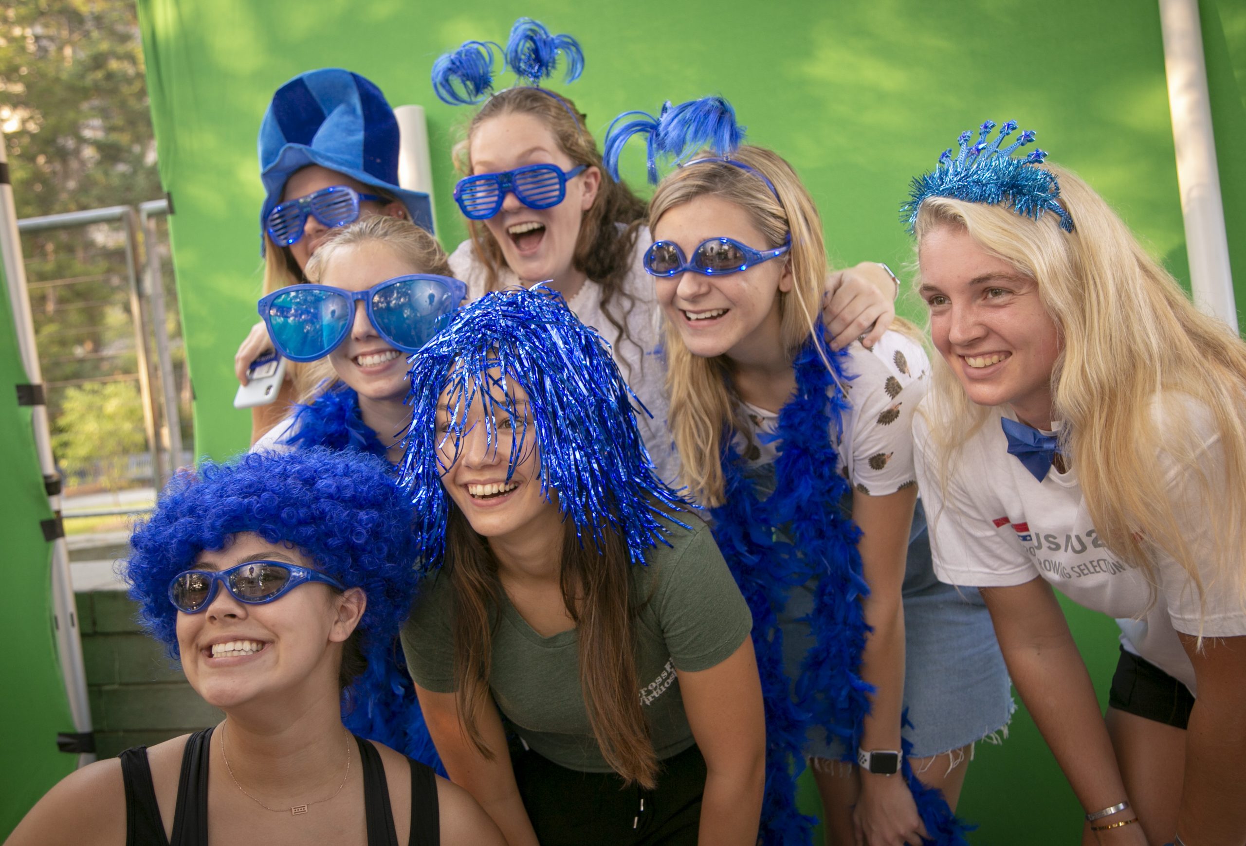 Duke Alumni with blue wigs and glasses