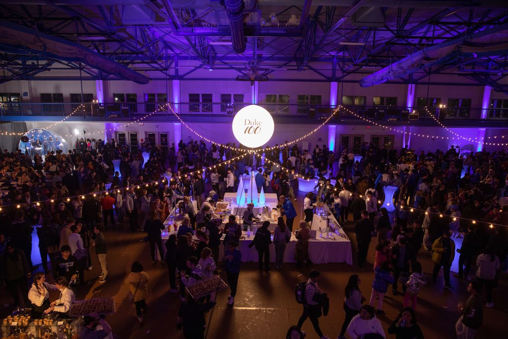 An overview photo of the Winter Chill inside Wilson Recreation Center with a Duke 100 illuminated ball suspended in the middle