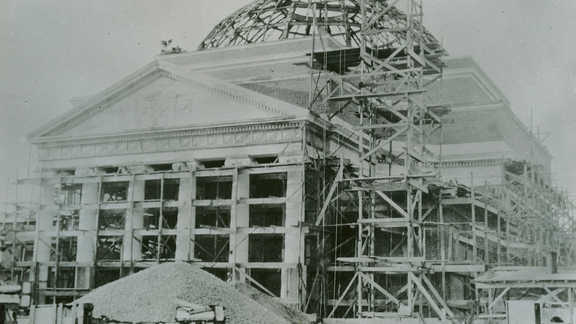 Black and white photo of Baldwin Auditorium with scafolding under construction