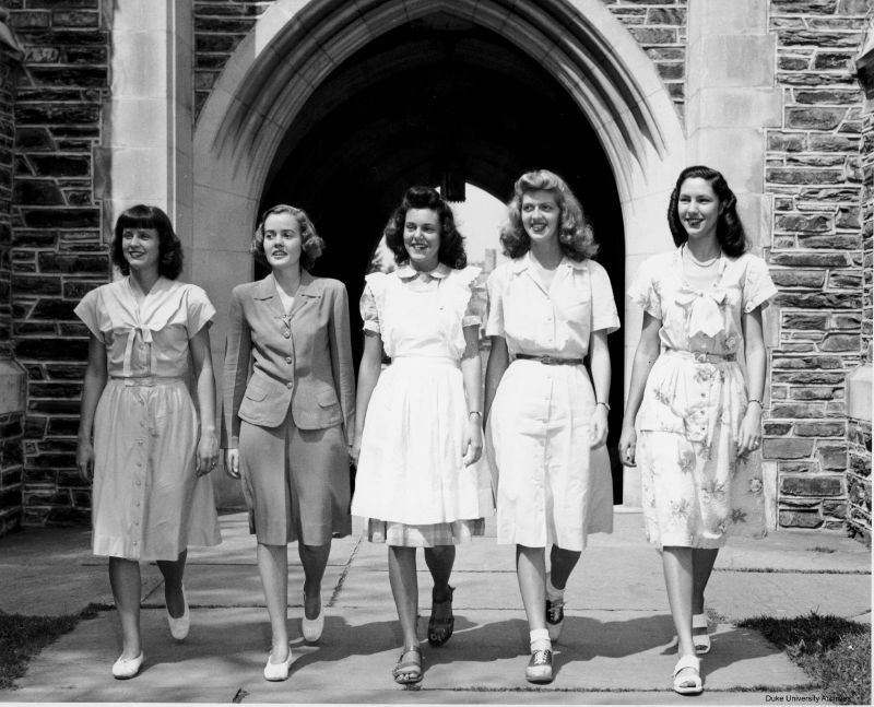 Five women posing in front of a Duke arch in 1946