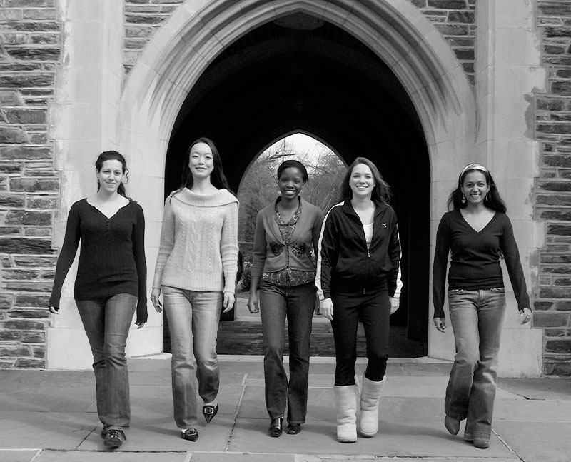 Five women posing in front of a Duke arch in 2007