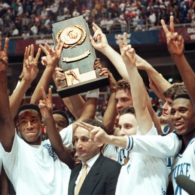 Coach K and the 1992 team holding up the NCAA title