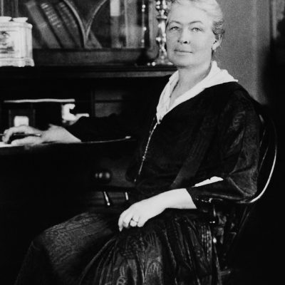 An old photo of Ellen Biddle Shipman sitting at a desk