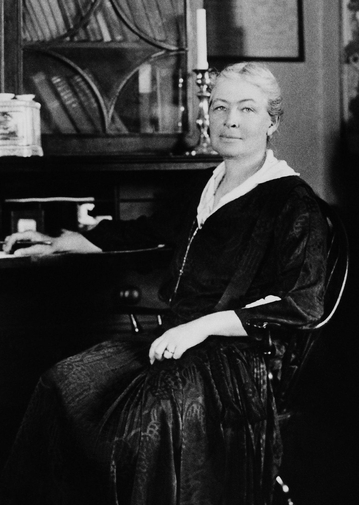 An old photo of Ellen Biddle Shipman sitting at a desk