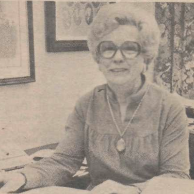 Christine Mimms sitting at a desk