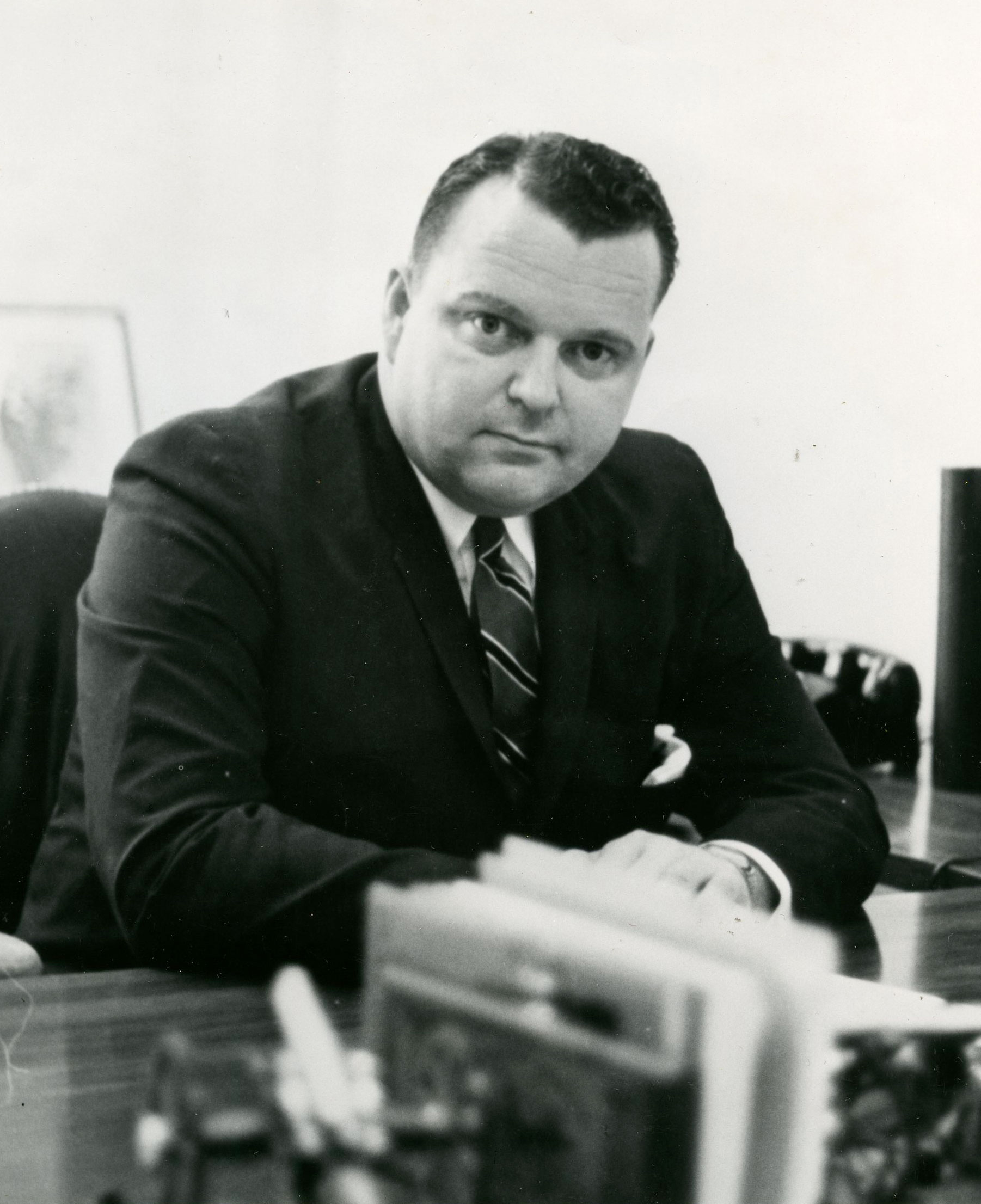 A. Kenneth Pye sitting at a desk