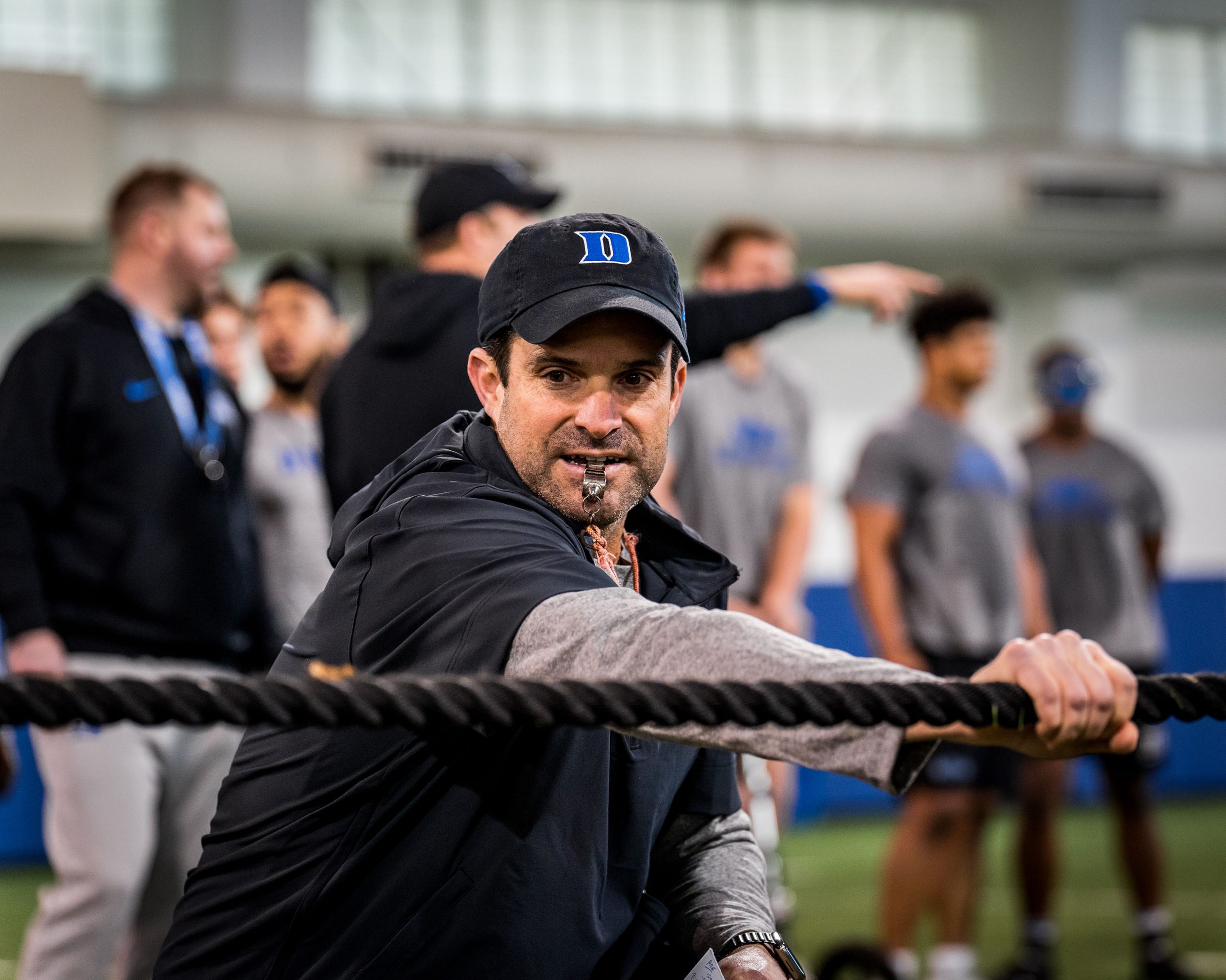 Coach Manny Diaz with a whistle in his mouth