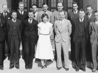 Members of the first MD class at Duke stand on steps for their class photo