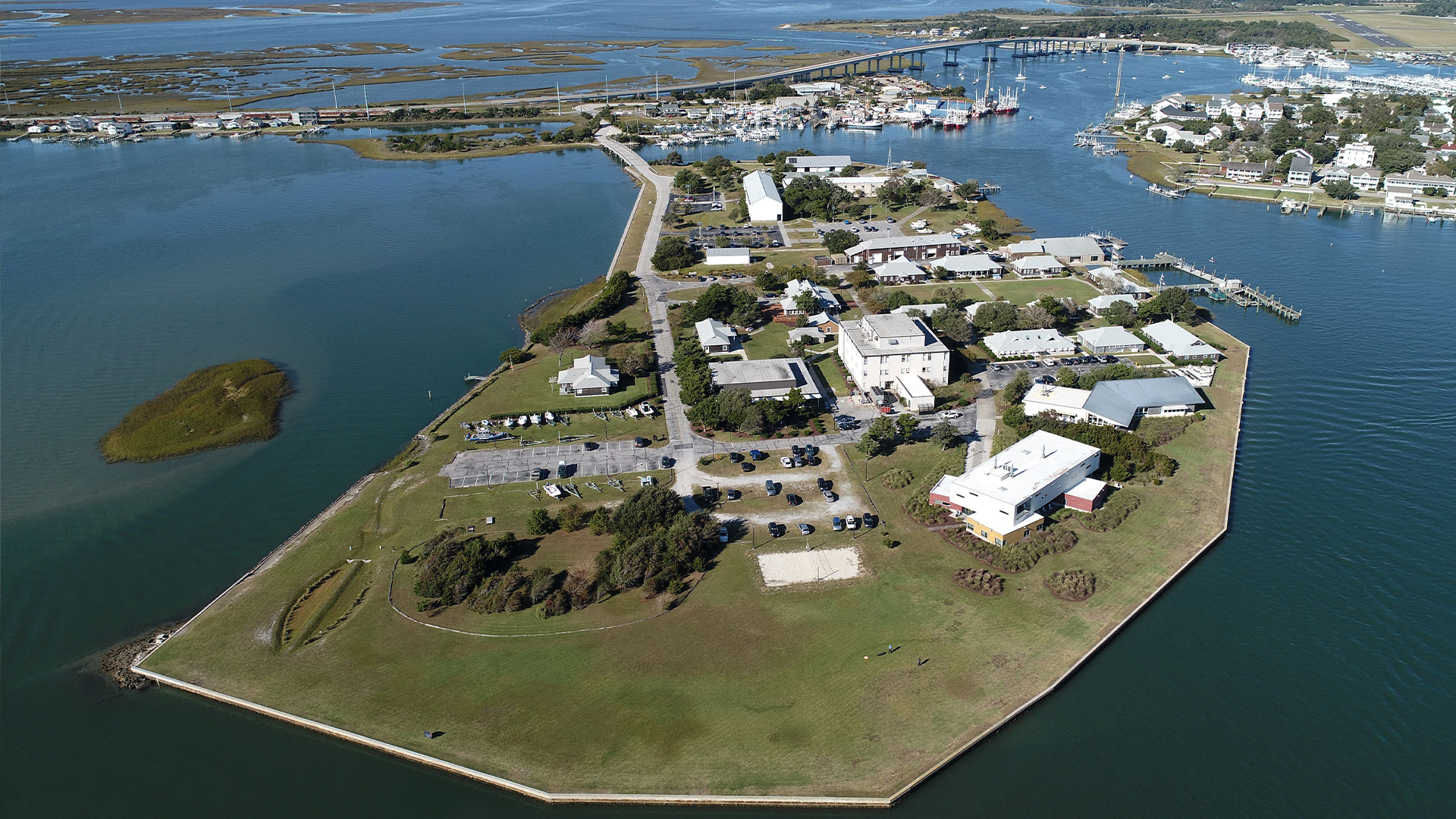 A current aerial photo of the marine lab with more buildings and a sea wall