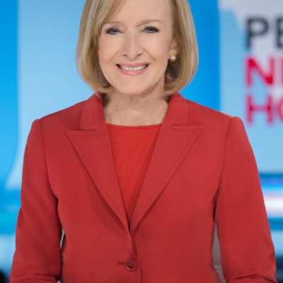 Judy Woodruff headshot on set of PBS New Hour